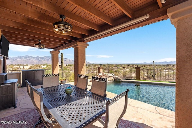 14171 N Gibson Trl, Tucson, AZ 85755 - view of patio with a mountain view, fence, and outdoor dining space