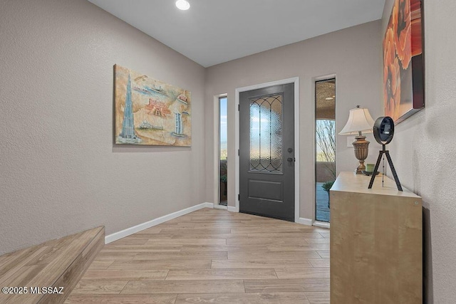14171 N Gibson Trl, Tucson, AZ 85755 - foyer featuring light wood-style floors, baseboards, and a textured wall