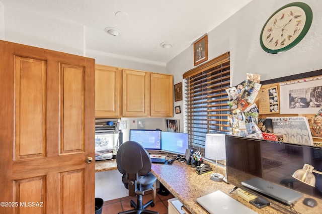 office space with tile patterned floors and plenty of natural light