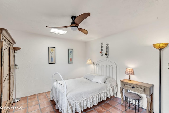 bedroom featuring a ceiling fan and tile patterned floors