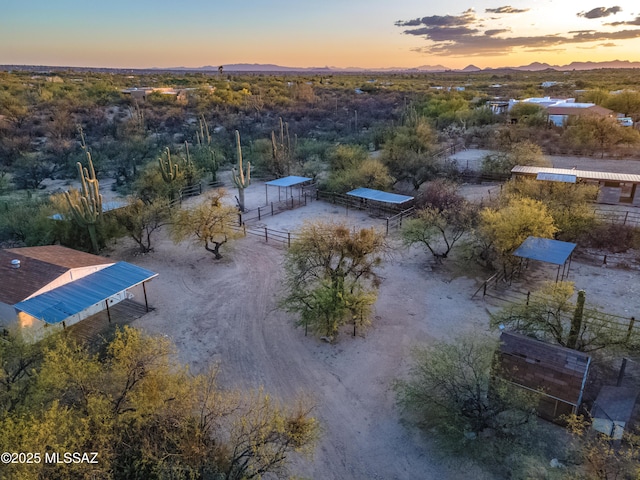 drone / aerial view featuring a mountain view and a rural view