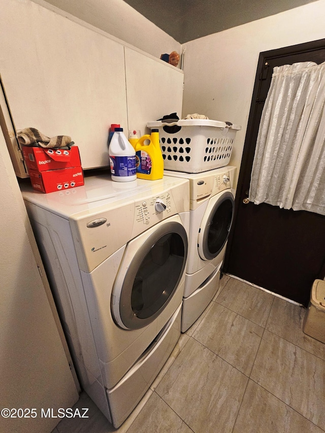 washroom featuring laundry area, tile patterned flooring, and washing machine and clothes dryer