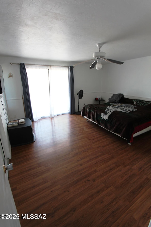 bedroom with a ceiling fan and wood finished floors