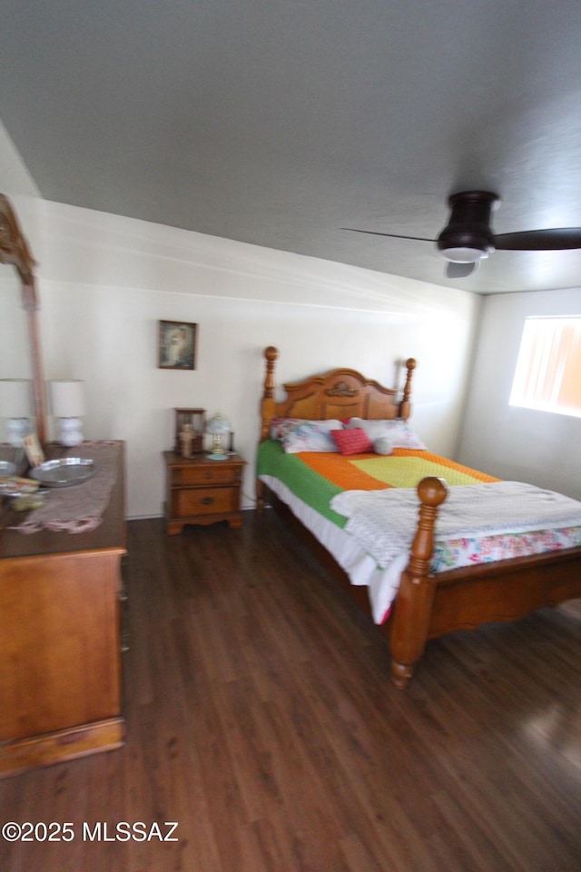 bedroom featuring a ceiling fan and wood finished floors