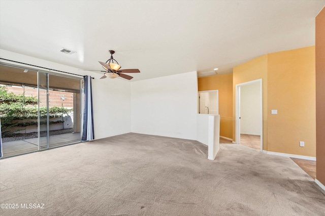 unfurnished room featuring a ceiling fan, visible vents, and carpet floors