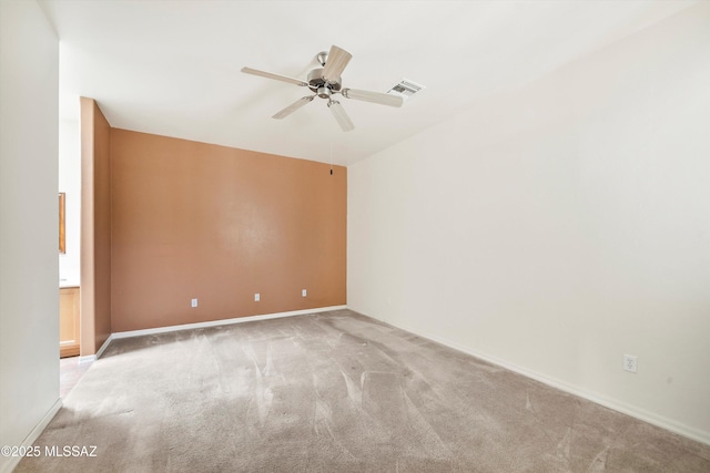 unfurnished room featuring visible vents, baseboards, a ceiling fan, and light carpet