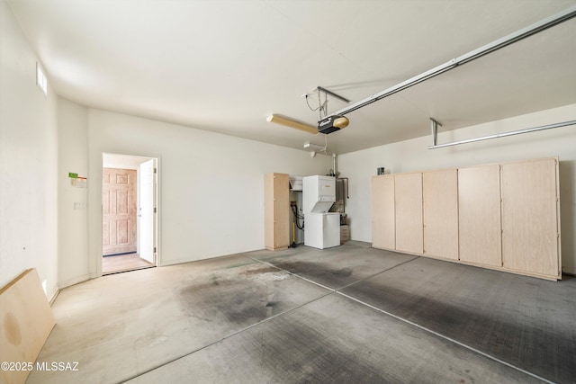 garage with a garage door opener and refrigerator
