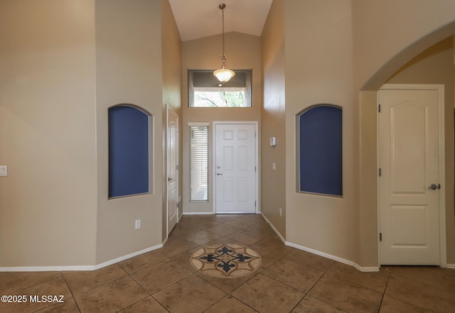 651 W Sonatina Ln, Oro Valley, AZ 85737 - tiled foyer featuring high vaulted ceiling, baseboards, and arched walkways