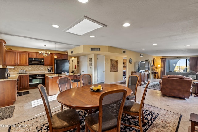 dining space featuring recessed lighting, visible vents, and light tile patterned floors