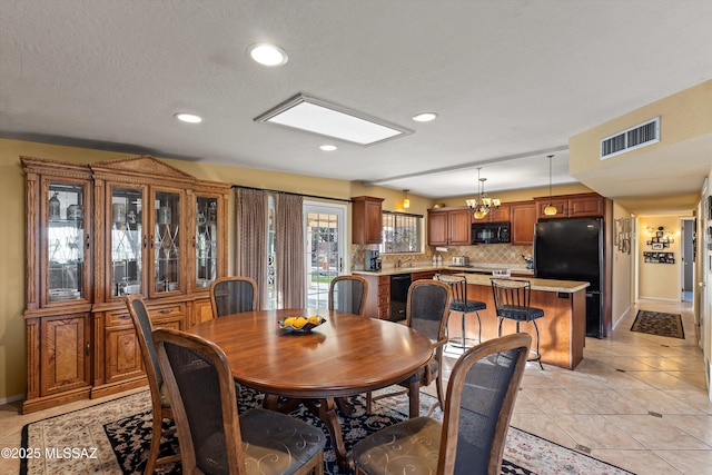 dining space featuring visible vents, light tile patterned floors, baseboards, a notable chandelier, and recessed lighting