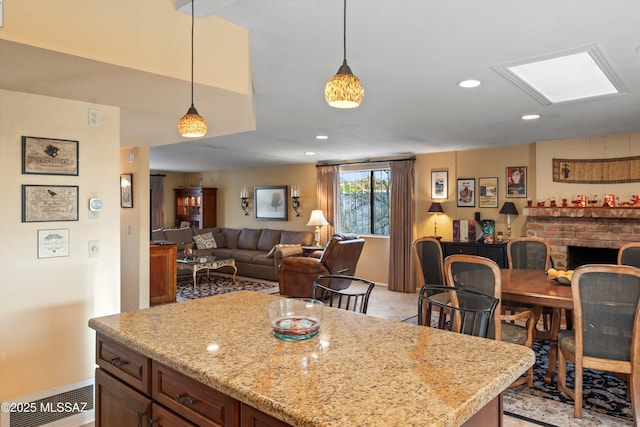 kitchen featuring a center island, decorative light fixtures, recessed lighting, and open floor plan