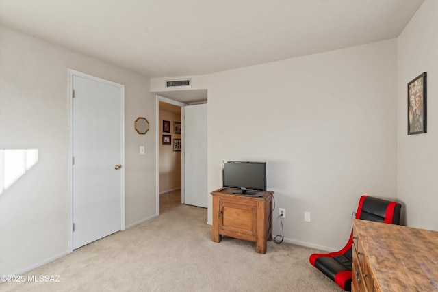 living area featuring baseboards, light colored carpet, and visible vents