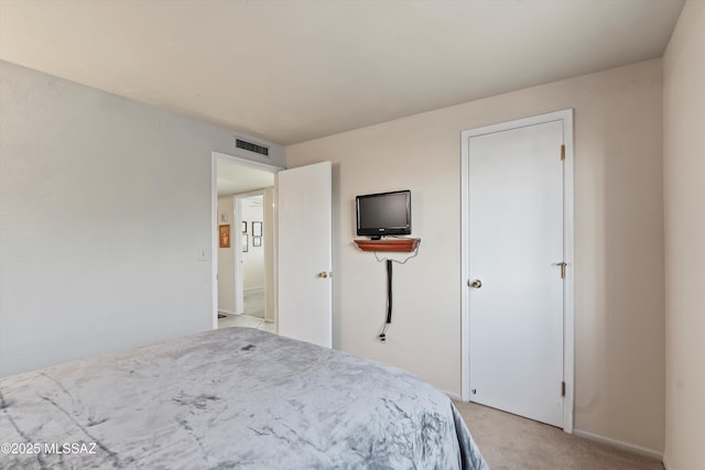 bedroom with light colored carpet, baseboards, and visible vents