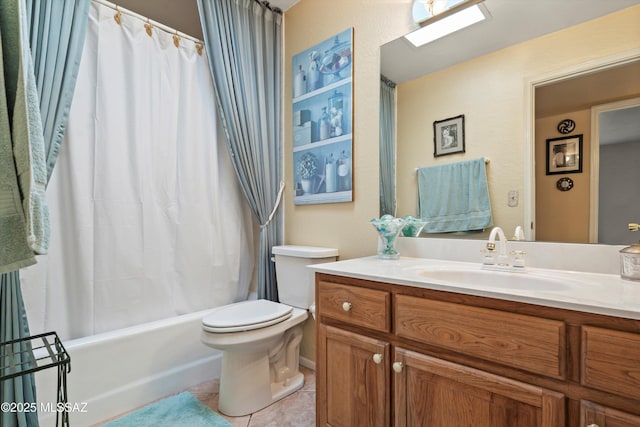 bathroom featuring tile patterned floors, shower / bath combo with shower curtain, vanity, and toilet