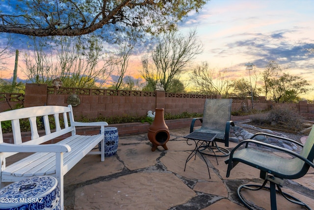 patio terrace at dusk with fence