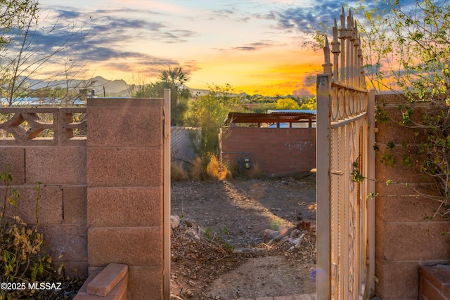 view of gate with fence