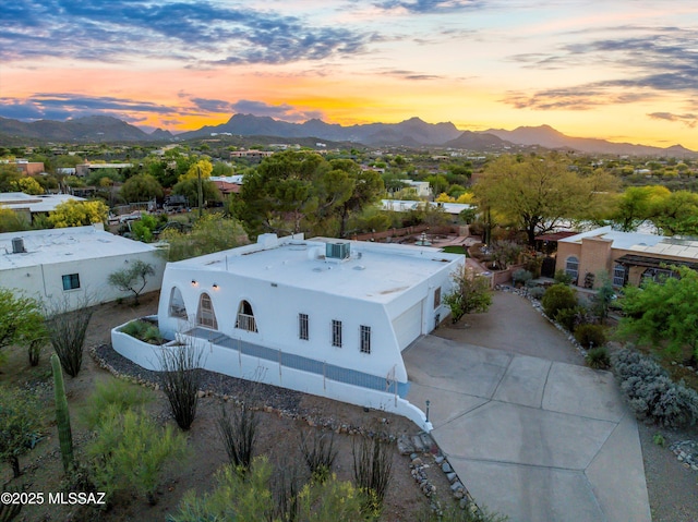 aerial view at dusk with a mountain view