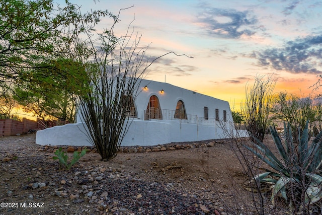 view of side of property featuring stucco siding