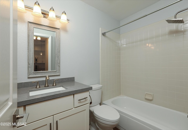 full bath featuring toilet, tub / shower combination, and vanity
