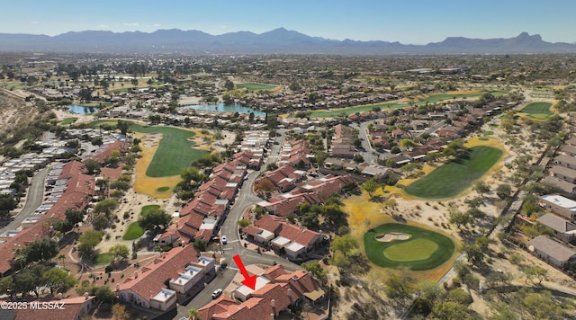 bird's eye view with view of golf course, a residential view, and a water and mountain view