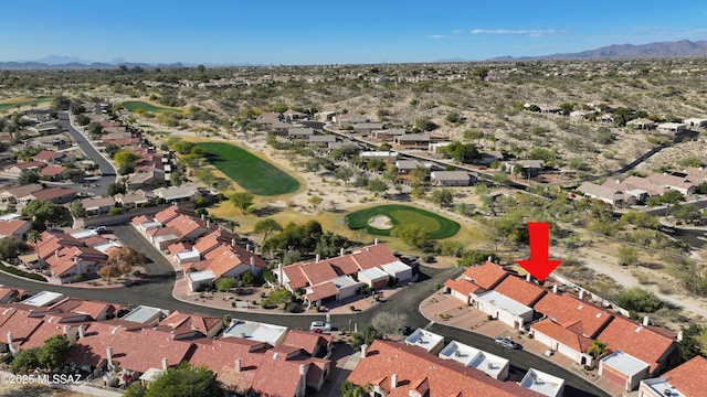 aerial view featuring a mountain view, golf course view, and a residential view