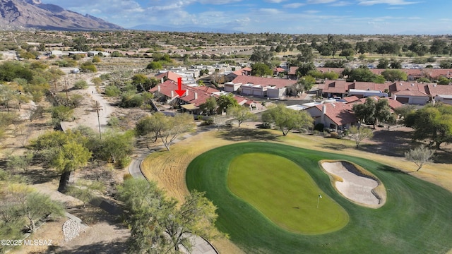 aerial view featuring a residential view, a mountain view, and golf course view