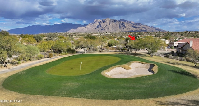 view of home's community featuring a mountain view and view of golf course
