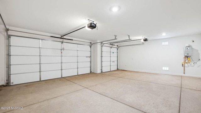 garage featuring recessed lighting and a garage door opener