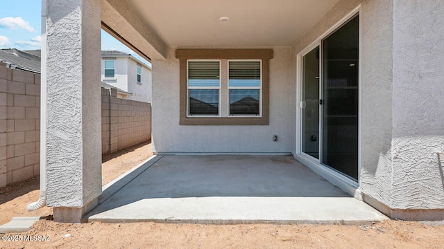 view of patio / terrace featuring fence