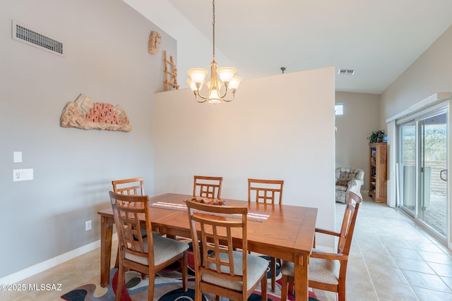 2740 E Ponce Ct, Green Valley, AZ 85614 - dining space featuring light tile patterned floors, a chandelier, vaulted ceiling, and baseboards