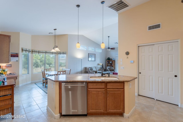 2740 E Ponce Ct, Green Valley, AZ 85614 - kitchen with stainless steel dishwasher, a sink, light tile patterned flooring, plenty of natural light, and high vaulted ceiling