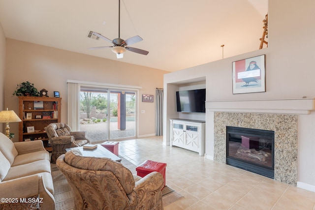 2740 E Ponce Ct, Green Valley, AZ 85614 - living area with ceiling fan, light tile patterned flooring, a glass covered fireplace, and baseboards