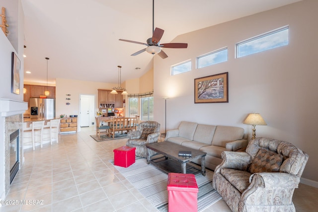 2740 E Ponce Ct, Green Valley, AZ 85614 - living area featuring high vaulted ceiling, ceiling fan, light tile patterned floors, a glass covered fireplace, and recessed lighting