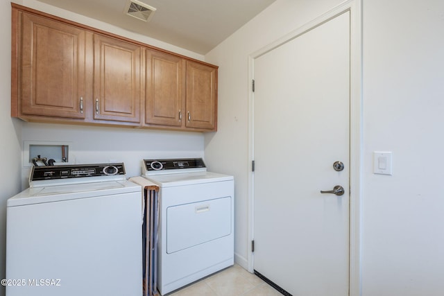 2740 E Ponce Ct, Green Valley, AZ 85614 - washroom featuring cabinet space, washer and dryer, and light tile patterned flooring
