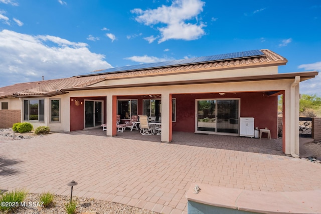 2740 E Ponce Ct, Green Valley, AZ 85614 - rear view of house featuring a patio area, a tiled roof, solar panels, and stucco siding