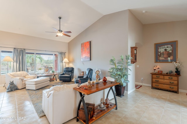 2740 E Ponce Ct, Green Valley, AZ 85614 - living room featuring light tile patterned floors, ceiling fan, high vaulted ceiling, and baseboards