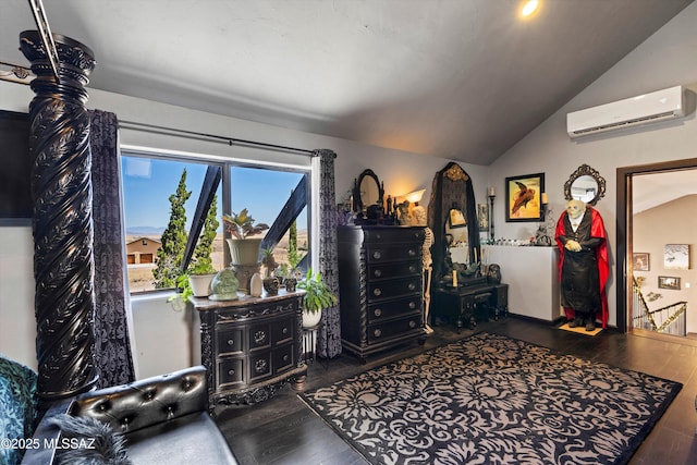 interior space with a wall unit AC, vaulted ceiling, and hardwood / wood-style floors