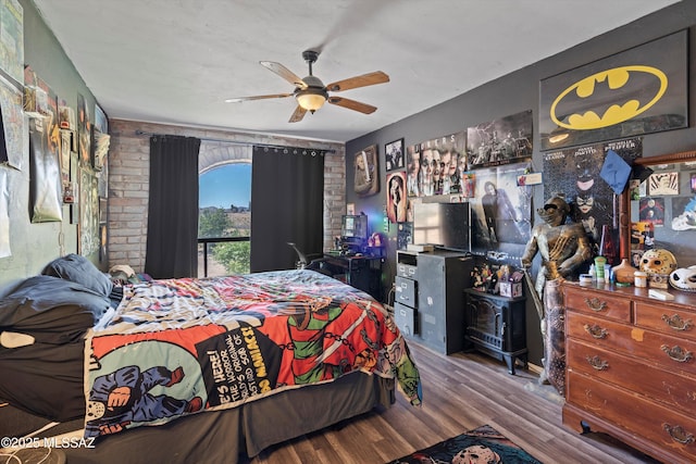 bedroom featuring ceiling fan and wood finished floors