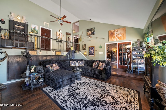 living room with high vaulted ceiling, ceiling fan, and hardwood / wood-style flooring