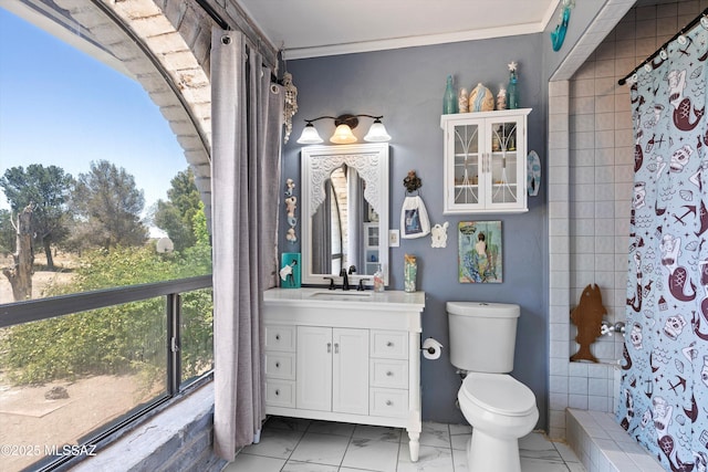 bathroom featuring vanity, crown molding, marble finish floor, toilet, and a shower with curtain