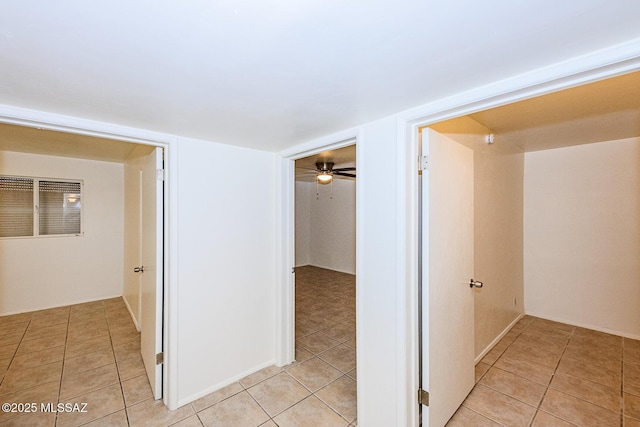 corridor featuring light tile patterned floors
