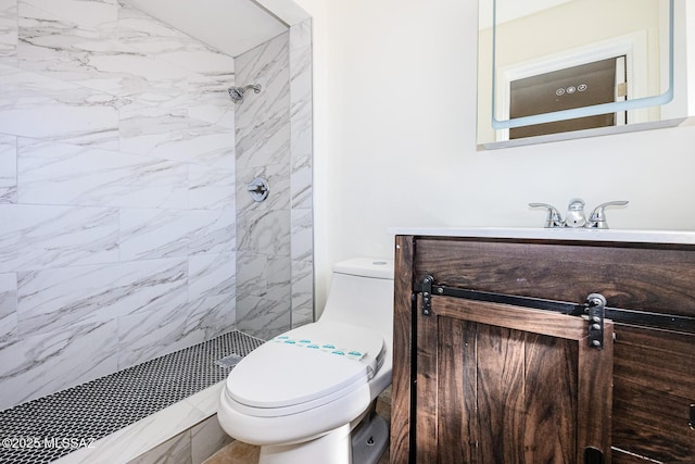 full bathroom featuring vanity, toilet, and tiled shower