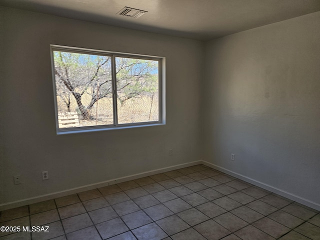 1220-B Circulo Aguilar, Rio Rico, AZ 85648 - unfurnished room featuring baseboards and light tile patterned flooring