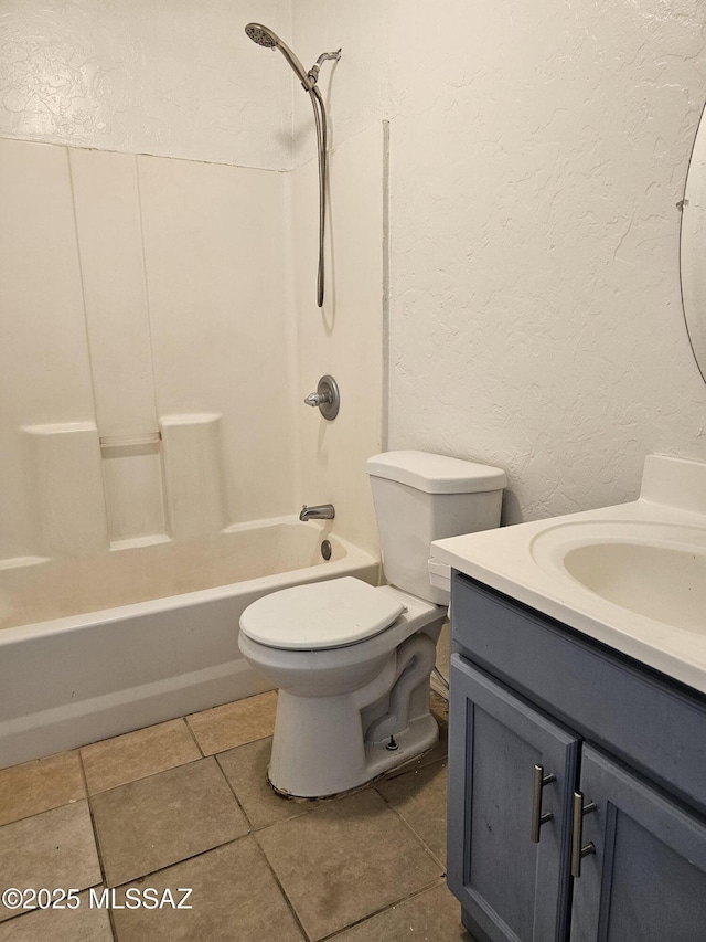1220-B Circulo Aguilar, Rio Rico, AZ 85648 - full bath featuring a textured wall, toilet, vanity, tile patterned flooring, and  shower combination