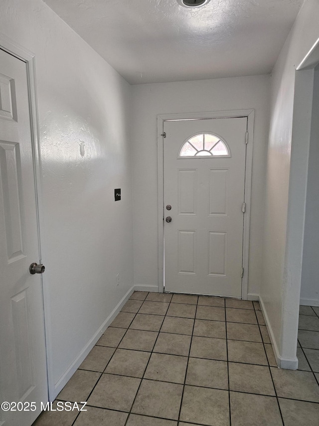 1220-B Circulo Aguilar, Rio Rico, AZ 85648 - entryway featuring light tile patterned flooring and baseboards