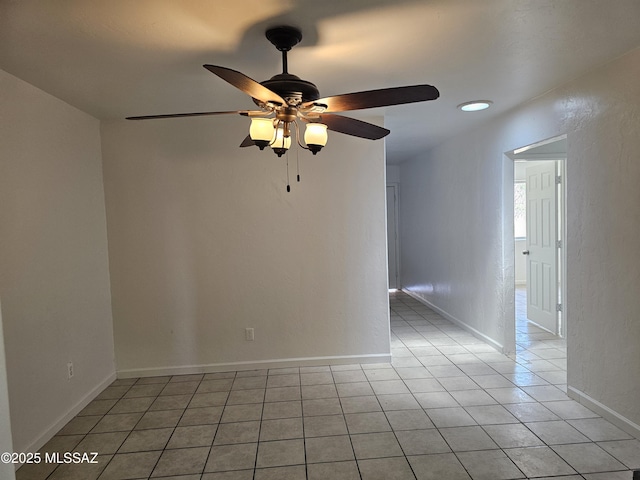 1220-B Circulo Aguilar, Rio Rico, AZ 85648 - spare room with ceiling fan, light tile patterned flooring, and baseboards