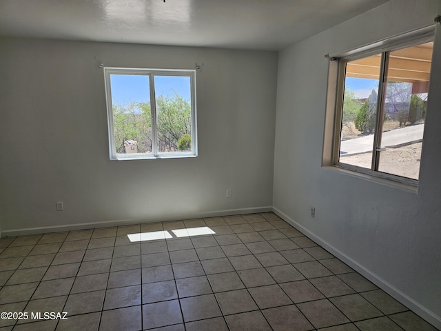 1220-B Circulo Aguilar, Rio Rico, AZ 85648 - spare room featuring healthy amount of natural light, baseboards, and light tile patterned floors
