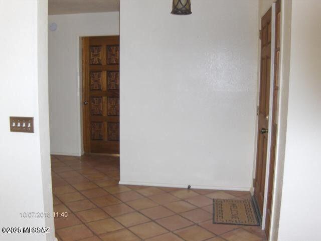 hallway featuring tile patterned floors