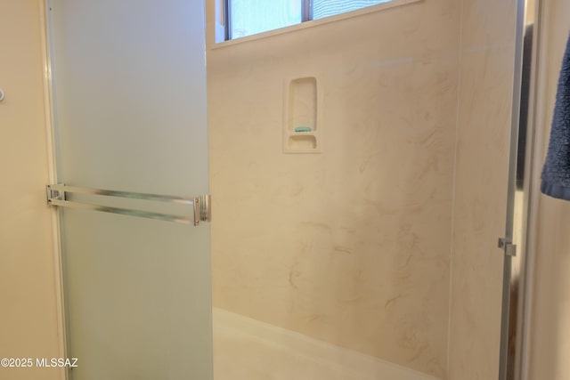 full bath featuring a shower stall