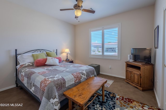 carpeted bedroom featuring baseboards and ceiling fan